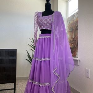 Purple lehenga choli with pearl details.